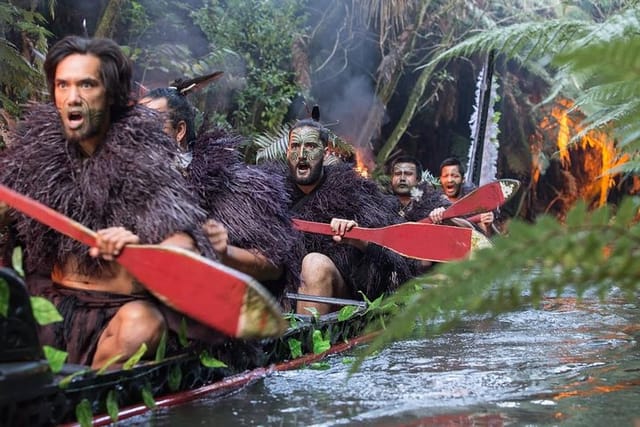 Warriors paddling the ancient war canoe